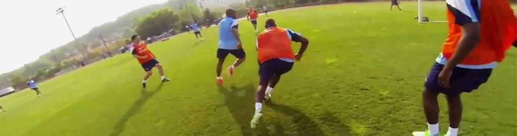 Manchester City players during training with GoPro camera attached.